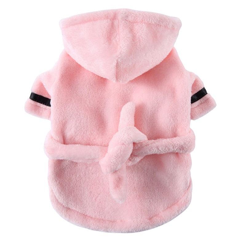 Small dog wearing soft pet bathrobe pajamas for quick drying and warmth after bath