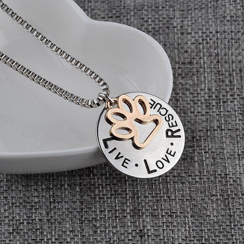 Round dog paw tag pendant necklace symbolizing love and rescue for animal lovers