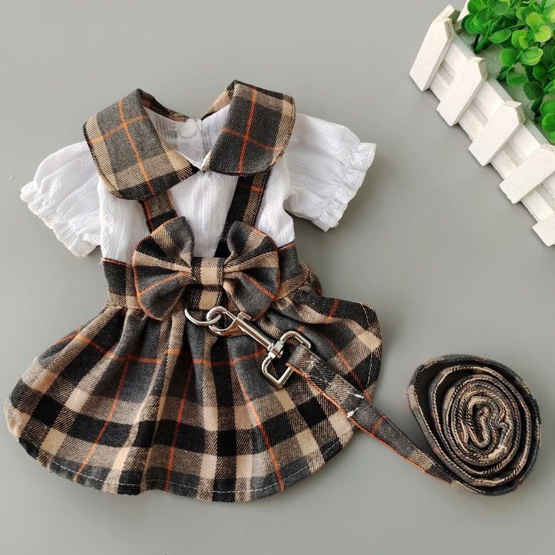Dog wearing cotton pet skirt dress with towing rope for spring and summer outings