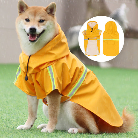 Large dog wearing yellow waterproof reflective strip raincoat poncho style with hood outdoors