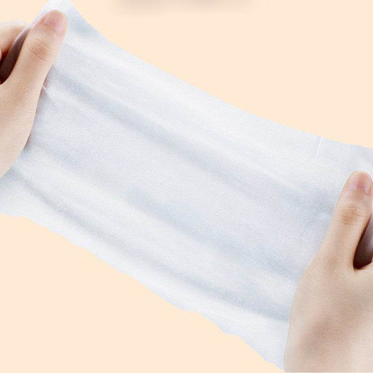 Hands holding and stretching a soft Pet Care Wet Wipes sheet for pet cleaning and eye care