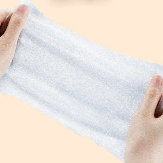 Hands holding and stretching a soft Pet Care Wet Wipes sheet for pet cleaning and eye care