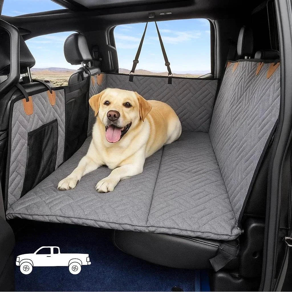 Dog sitting comfortably on a waterproof Dog Seat Extender in a car's back seat, providing safety and extra space during travel