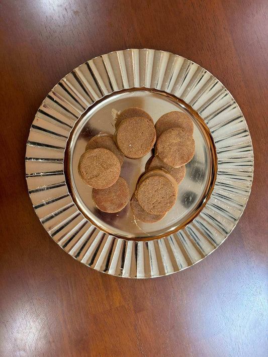 Organic peanut butter macarons dog treats on silver plate