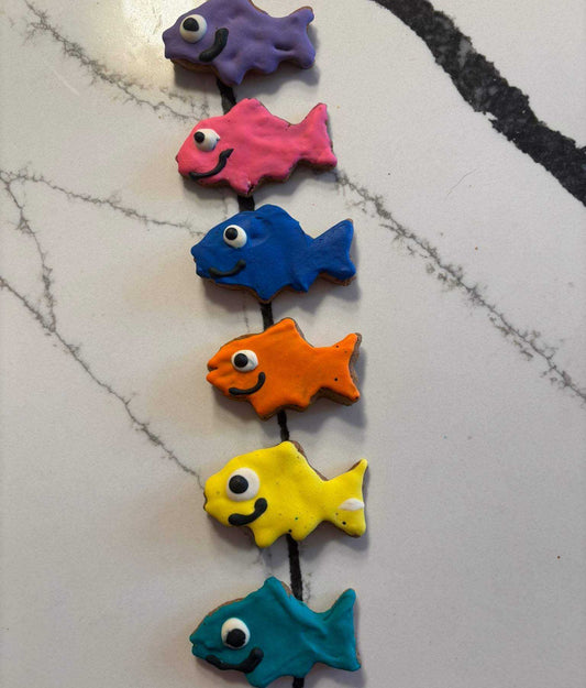 Colorful fish-shaped Pawquarium Treats for dogs made with organic ingredients and dog-safe icing