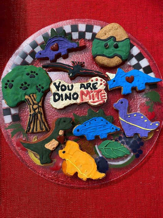 Dinosaurs Organic Dog Cookie Box with colorful dinosaur-shaped organic dog treats on a plate