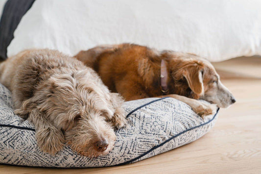 Round indigo Sunbrella fabric pet bed with distressed diamond pattern for dogs