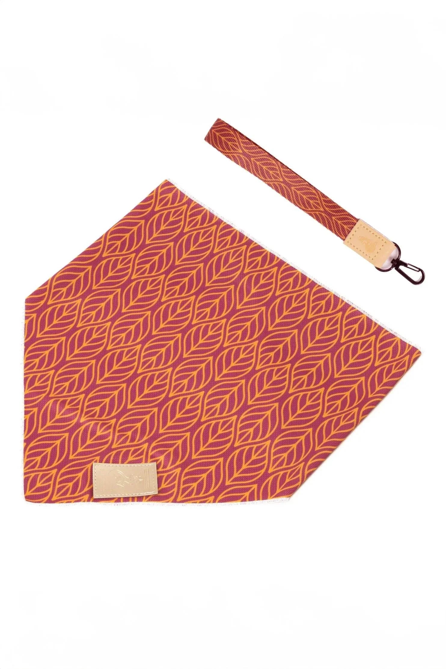Twilight Trails vibrant dog bandana and matching vegan leather keychain set with red and orange leaf pattern