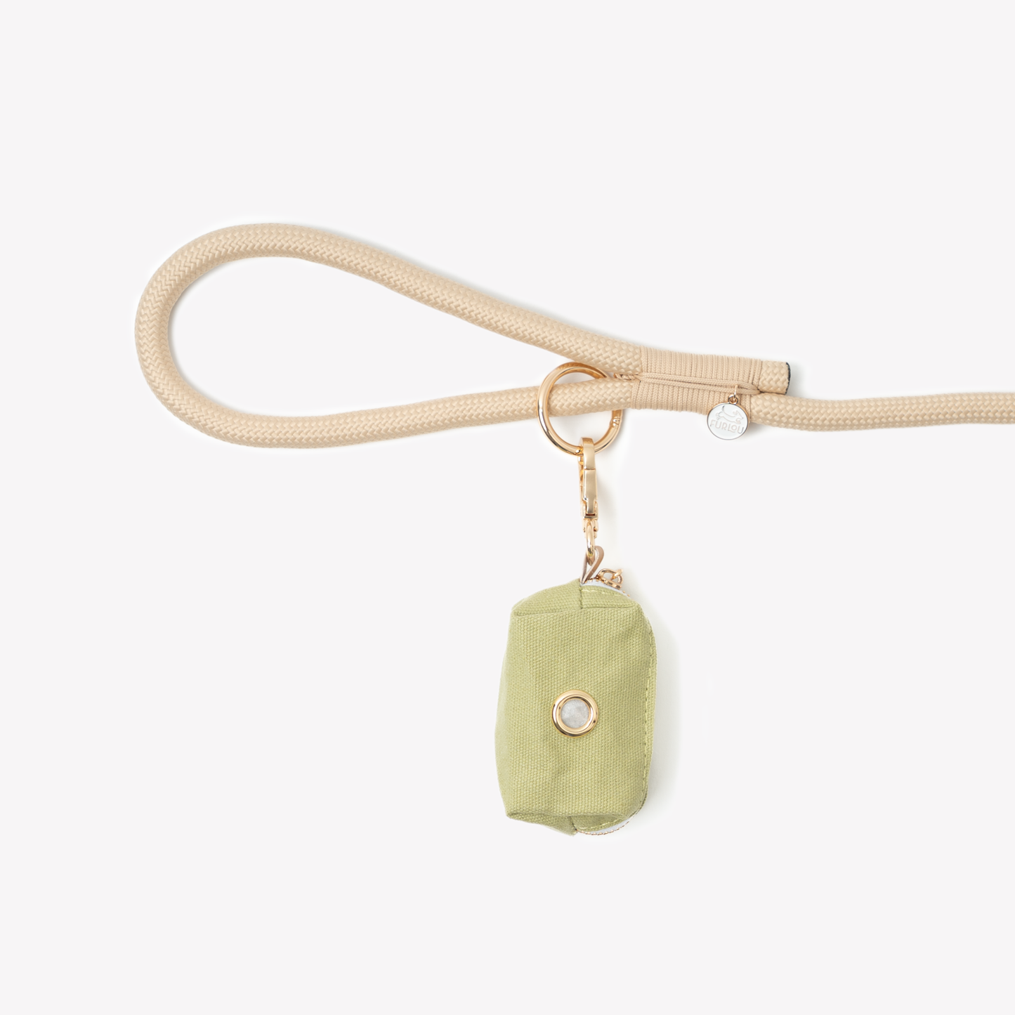 Green poop bag holder pouch clipped to beige dog leash with keyring attachment