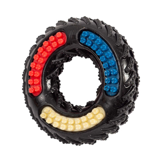 Country Living Tire of Fun black TPR textured dog chew toy with red, blue, and yellow bristles for interactive play