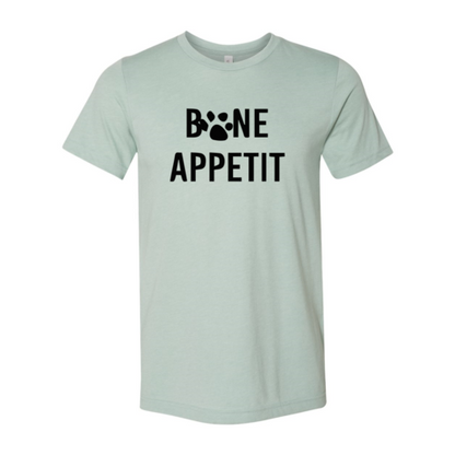 Bone Appetit T-Shirt in light green with black paw print design, made of soft ring spun cotton by Bella Canvas