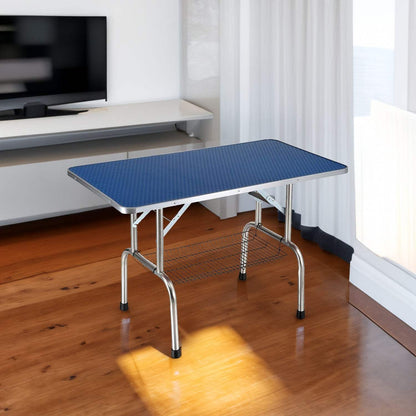 Large 46-inch blue pet grooming table with adjustable arm, stainless steel legs, and skid-resistant rubber surface for dogs and cats