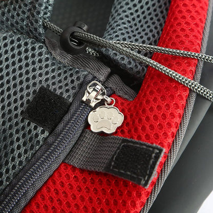 Close-up of breathable mesh pet carrier handbag with zipper and paw-shaped pull charm