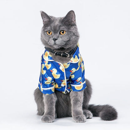 French Bulldog wearing soft pet silk duck pajamas with button closure and duck pattern