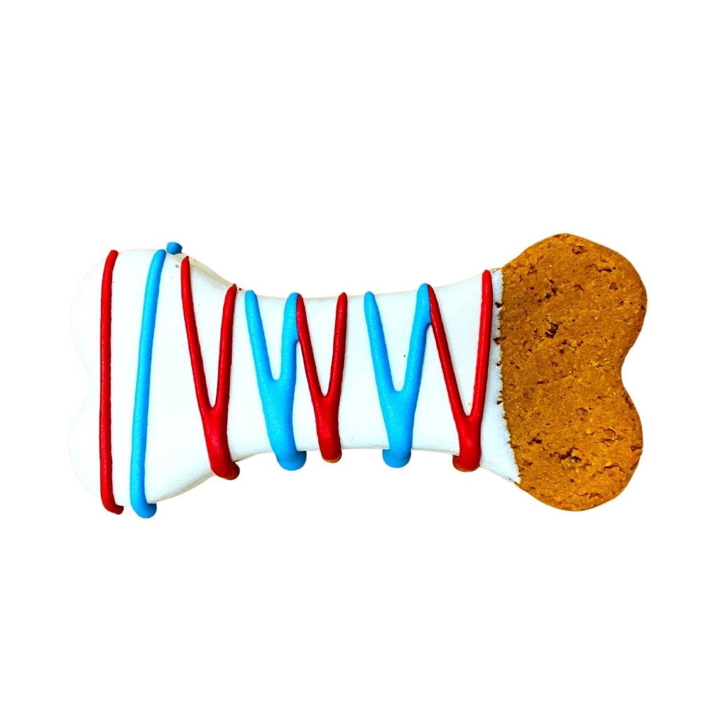Dipped Bones dog treat with red and blue icing on bone-shaped cookie