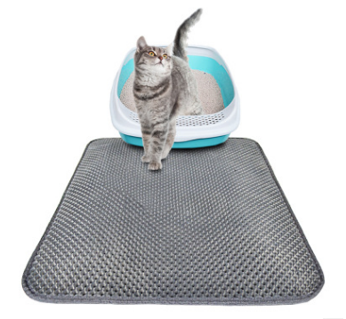 Gray honeycomb cat litter pad with waterproof EVA foam under a cat using litter box