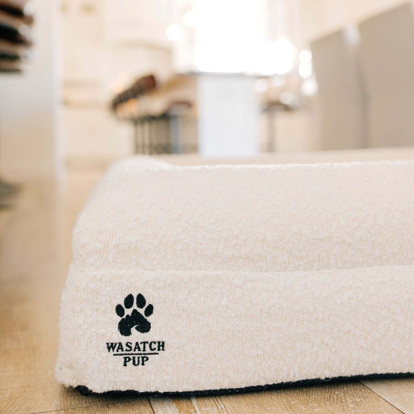 Luxury orthopedic dog bed with memory foam, plush boucle cover, and raised bolsters for comfort and support
