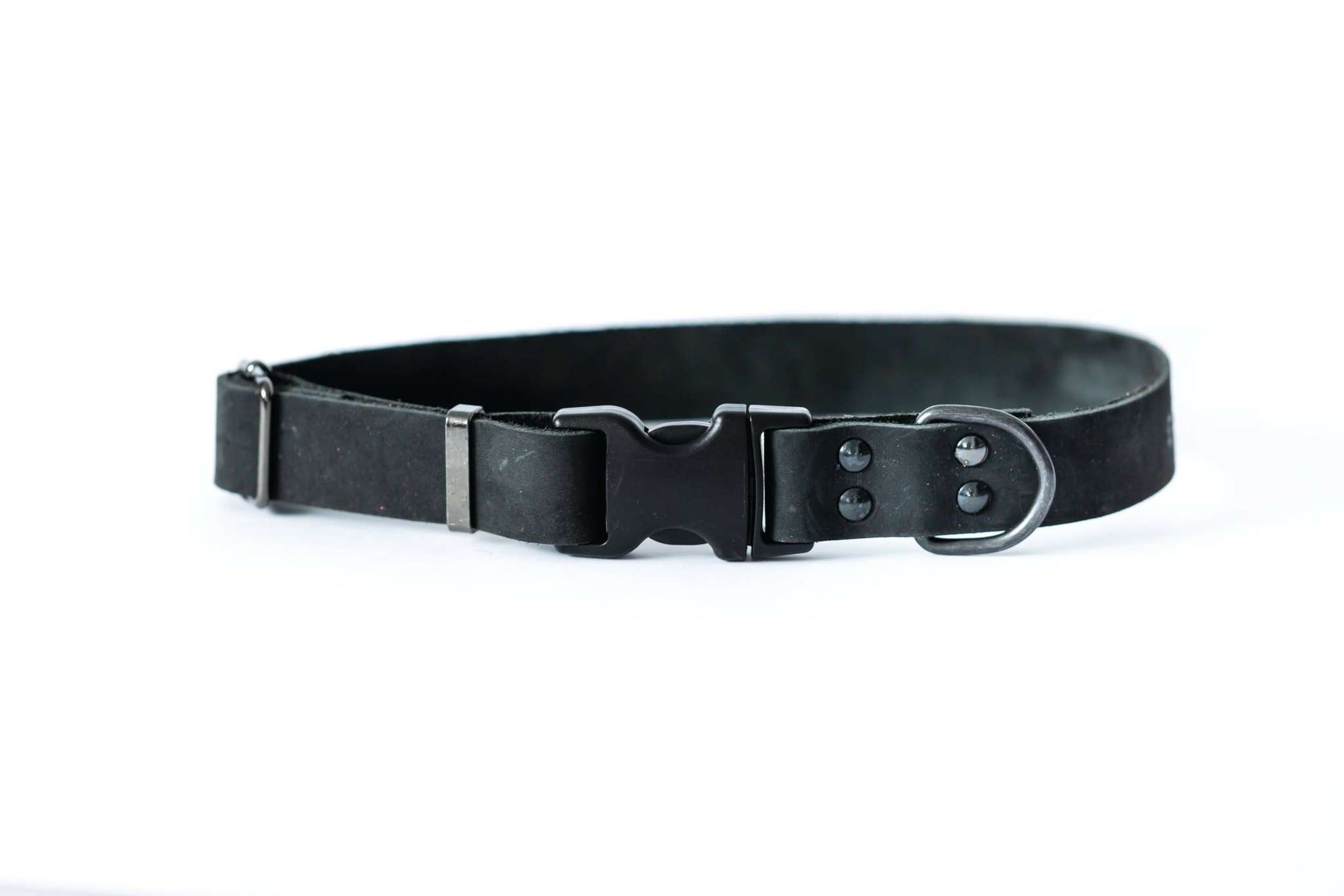 Sport style midnight black leather dog collar with quick-release black hardware and strong polyacetal YKK buckle.