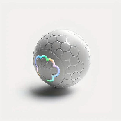 White interactive pet toy ball with hexagonal texture and glowing multicolor paw print LED light