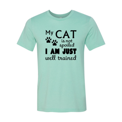 My Cat Is Not Spoiled T-Shirt in light green with black text and paw prints, soft ring spun cotton, Bella Canvas brand.