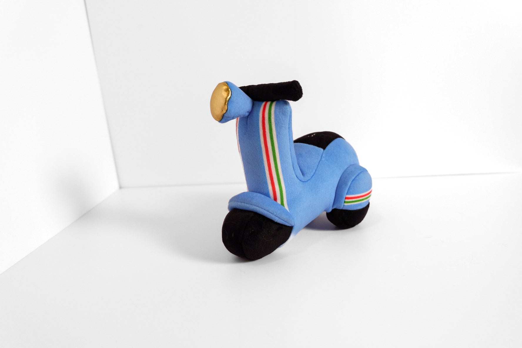 Blue Scooter Pet Plush Toy with colorful stripes, soft and squeaky for pet play