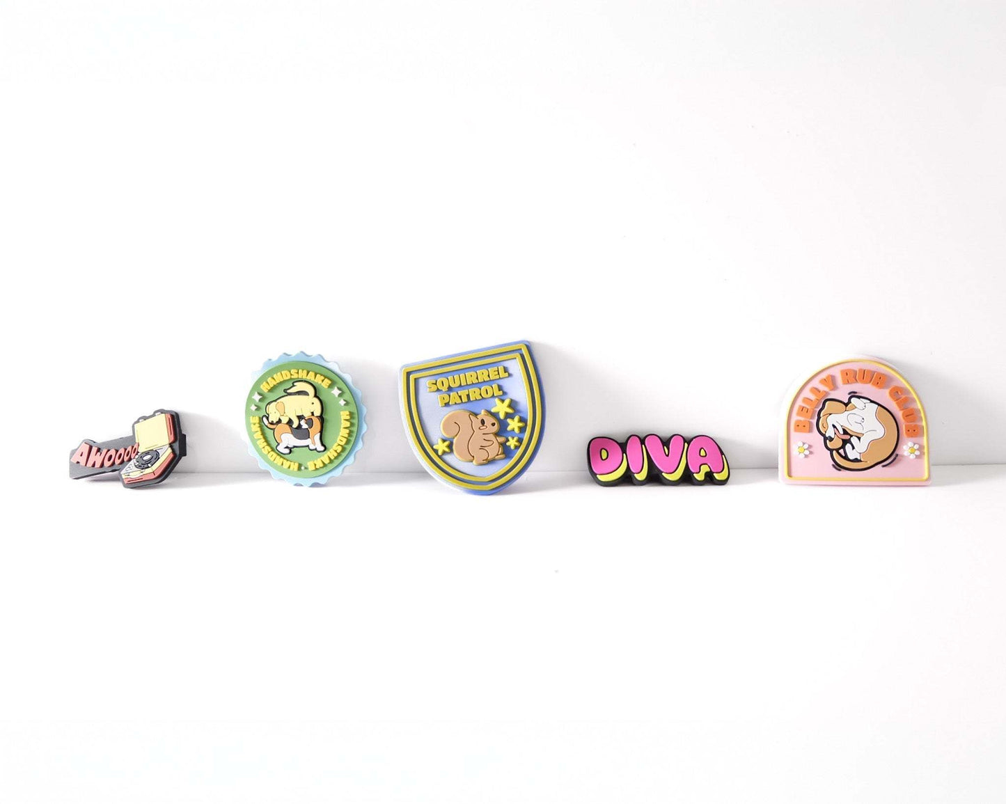 Colorful and playful Collar & Leash Tabs for dogs, featuring various fun designs to personalize collars and leashes.