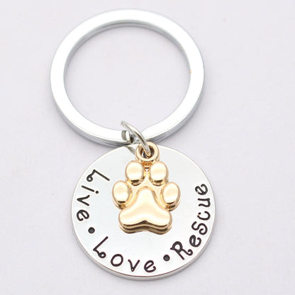 Live Love Rescue pet lover dog necklace with gold paw charm on stainless steel box chain