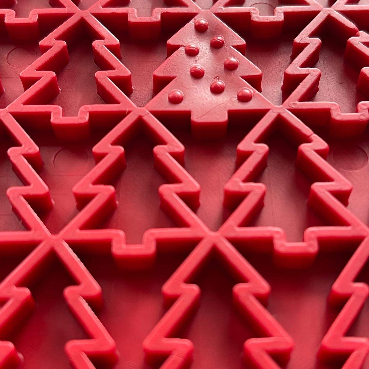 Red Peace Tree eMat with textured Christmas tree and peace symbol design for dog enrichment and anxiety relief
