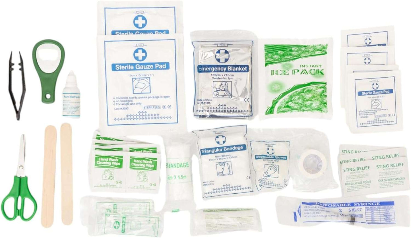 Country Living 50-Piece Pet Travel First Aid Kit with gauze pads, bandages, emergency blanket, ice pack, gloves, scissors, syringe, sting relief pads, and cleaning wipes for pet emergencies and travel safety.
