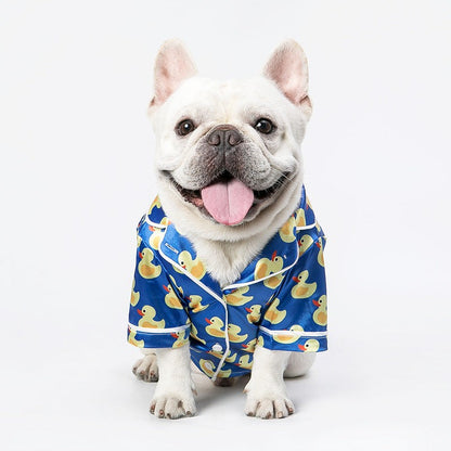 French Bulldog wearing soft pet silk duck pajamas with button closure and duck pattern