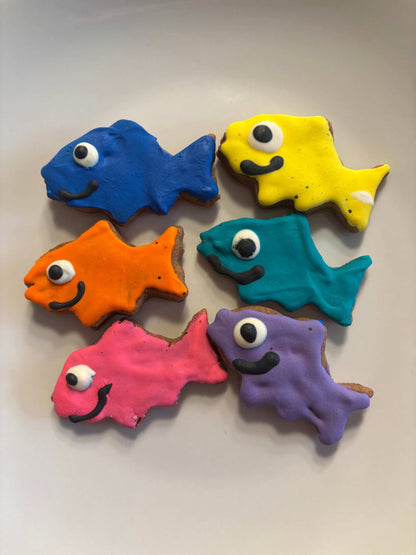 Colorful fish-shaped Pawquarium Treats with vibrant dog-safe icing, handmade and organic dog cookies.