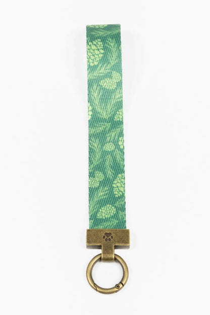 Pine Cone Pup green pine cone patterned wristlet keychain with brass ring and clasp