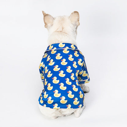 French Bulldog wearing soft pet silk duck pajamas with button closure and duck pattern