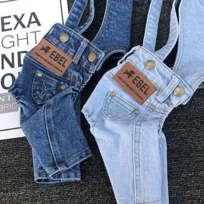 Two denim jumpsuits for small dogs in dark and light blue with adjustable straps and front pockets