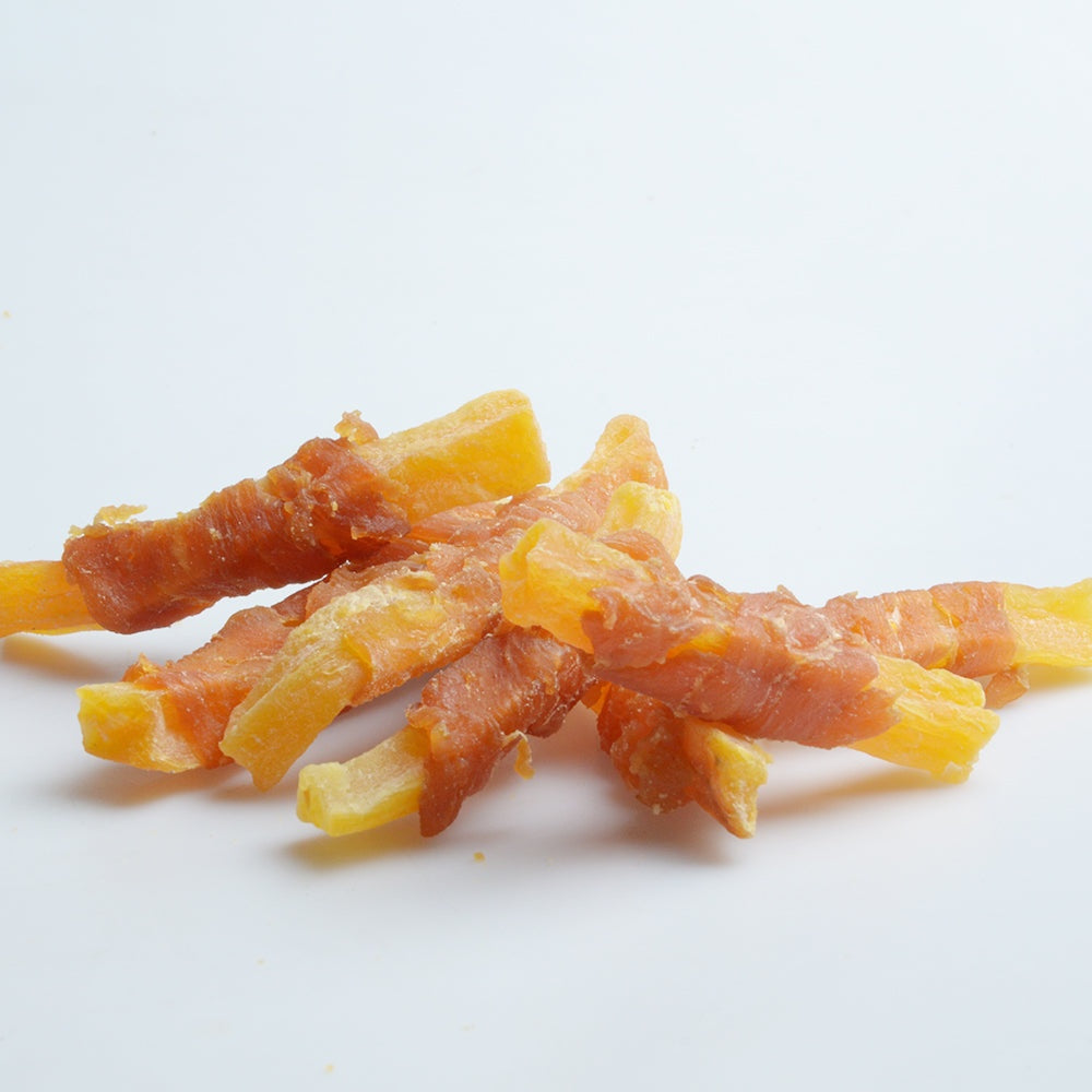 Jack PetPals Crafted Bite chicken and sweet potato dog treats stacked on white background