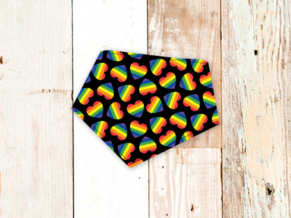 Love is Love Dog Bandana with rainbow heart pattern on black background for Pride celebration