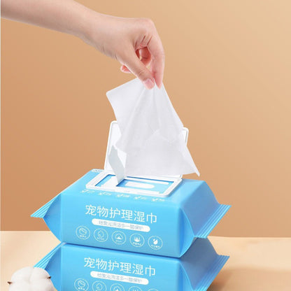 Pet Care Wet Wipes for dogs and cats in blue pack with hand pulling out a wipe, 100 non-woven sheets for cleaning body, eyes, and ears
