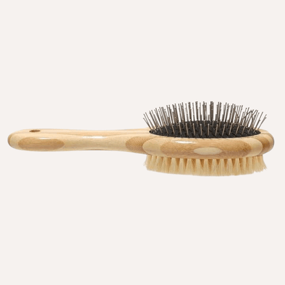 Two-sided pet brush with bamboo handle featuring bristle and wire sides for shedding and detangling
