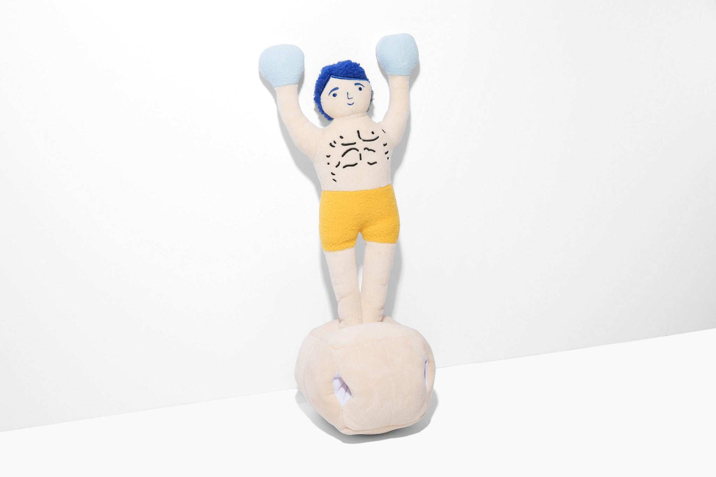 Champ Rocky Nose Work Dog Toy plush boxing champion with treat-dispensing gloves on pedestal for interactive play and mental stimulation