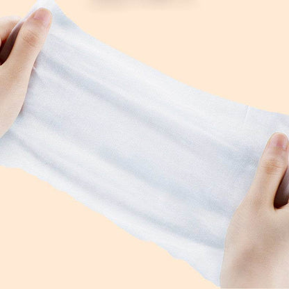 Hands holding and stretching a soft Pet Care Wet Wipes sheet for pet cleaning and eye care