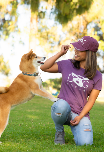 Woman wearing plum Dog Lover T-shirt | Stylish Plum Women's Dog T-shirt for Enthusiasts playing with a dog outdoors