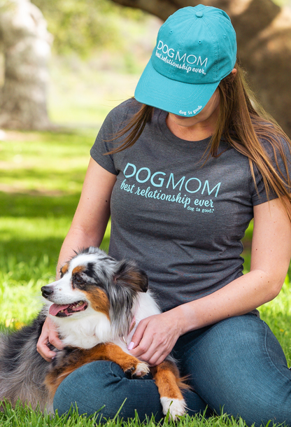 Turquoise Dog Mom Hat with embroidered "Dog Mom, Best Relationship Ever" text worn outdoors