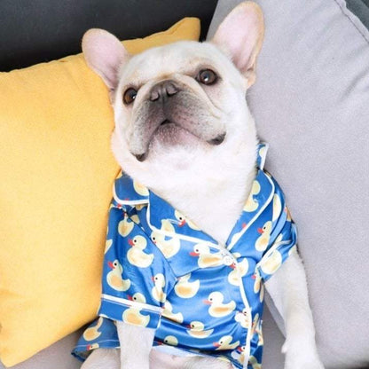 French Bulldog wearing soft pet silk duck pajamas with button closure and duck pattern