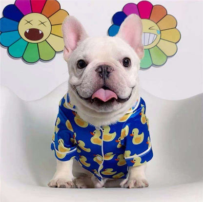 French Bulldog wearing soft pet silk duck pajamas with button closure and duck pattern
