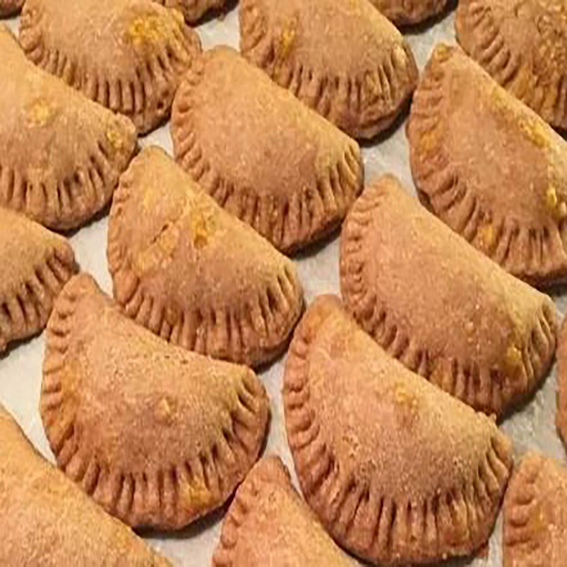 Handmade organic beef EmPAWnadas dog treats with soft whole-wheat pastry baked fresh