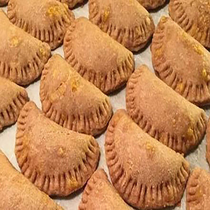 Handmade organic beef EmPAWnadas dog treats with soft whole-wheat pastry baked fresh