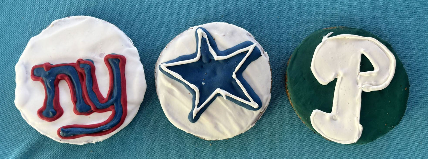 Organic football sports team cookies with New York Giants, Dallas Cowboys, and Philadelphia Eagles logos, dog-friendly and handmade with natural ingredients.