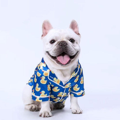 French Bulldog wearing soft pet silk duck pajamas with button closure and duck pattern