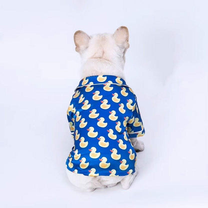 French Bulldog wearing soft pet silk duck pajamas with button closure and duck pattern
