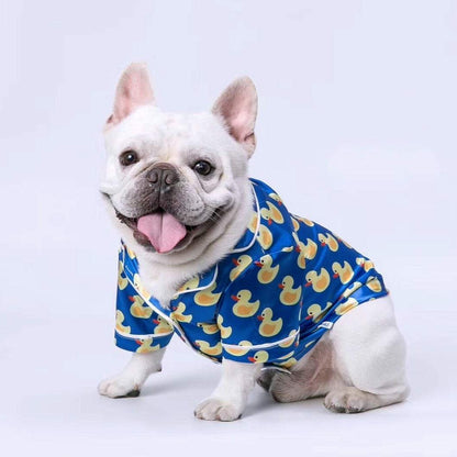 French Bulldog wearing soft pet silk duck pajamas with button closure and duck pattern